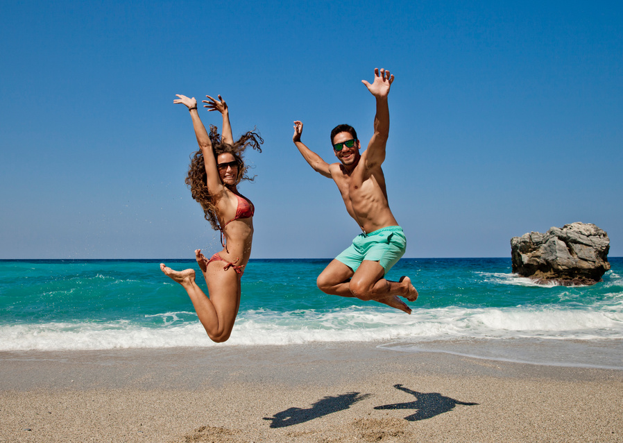 Jumping Beach Couple